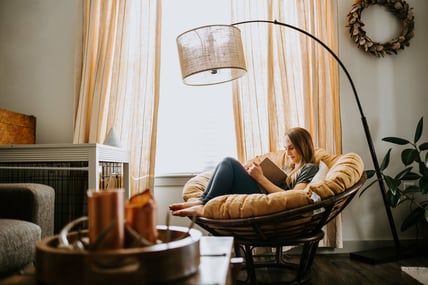 woman reading at home - fall season - reduced